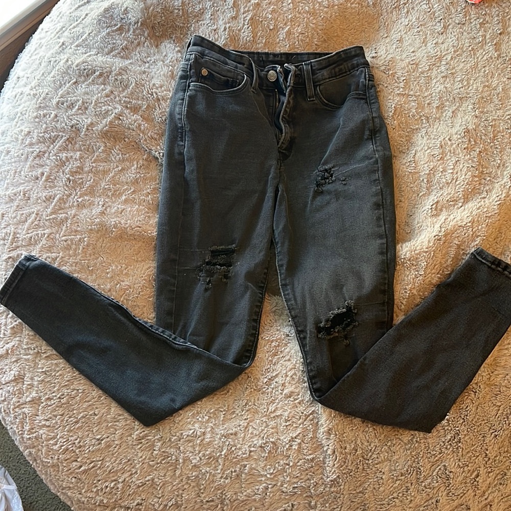 perfect condition, black jeans, rips in legs,